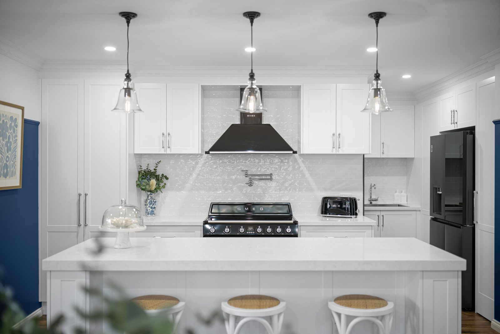 Kitchens U Build project with a white stone bench top and pendant lighting