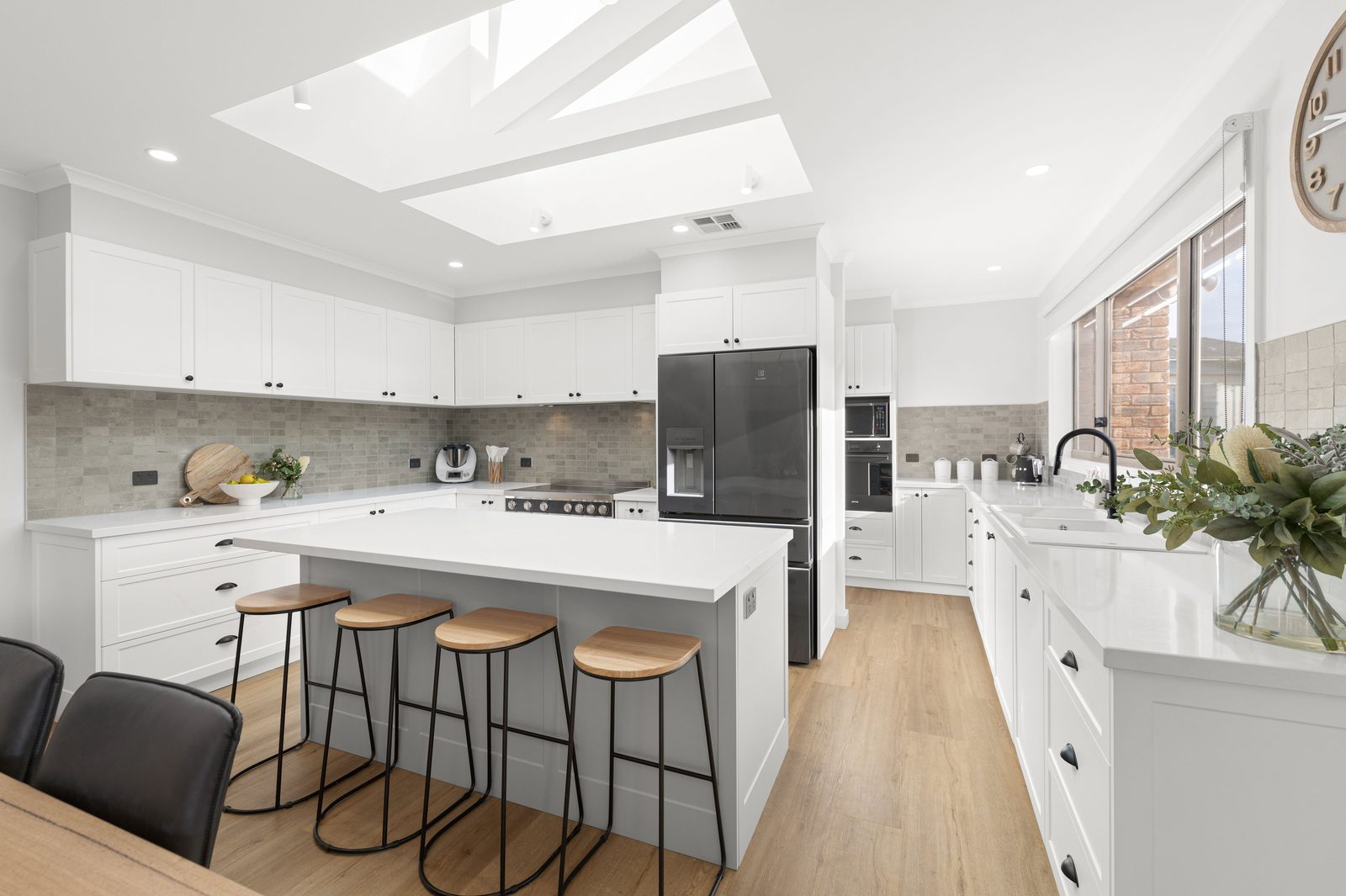 Kitchens U Build project with a white stone island bench under a skylight